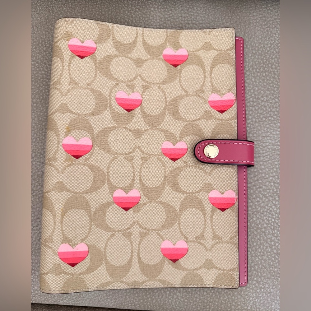 Coach signature print with hearts notebook cover.